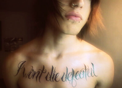 Hot tattoo, “I won’t die defeated”